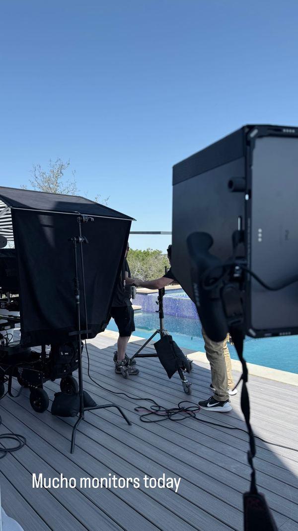 Monitors set up on a pool deck