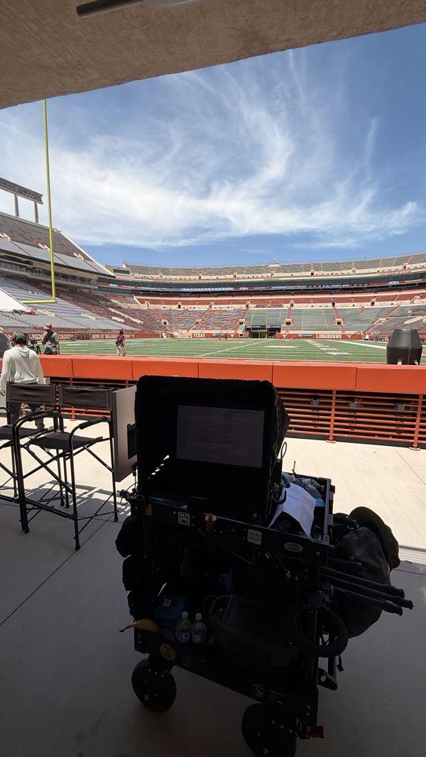 Tech cart on the sideline of a football stadium